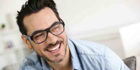 smiling man wearing glasses