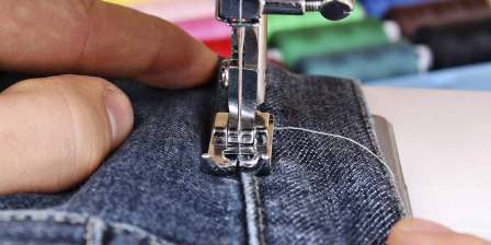 close up of sewing machine and fabri