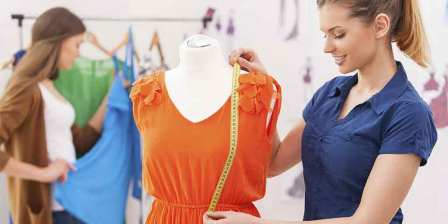 woman measuring orange clothes
