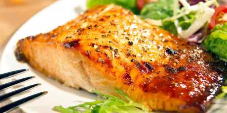 healthy looking glazed salmon with salad