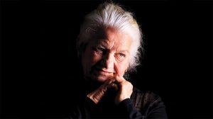 elderly woman with clasped hands