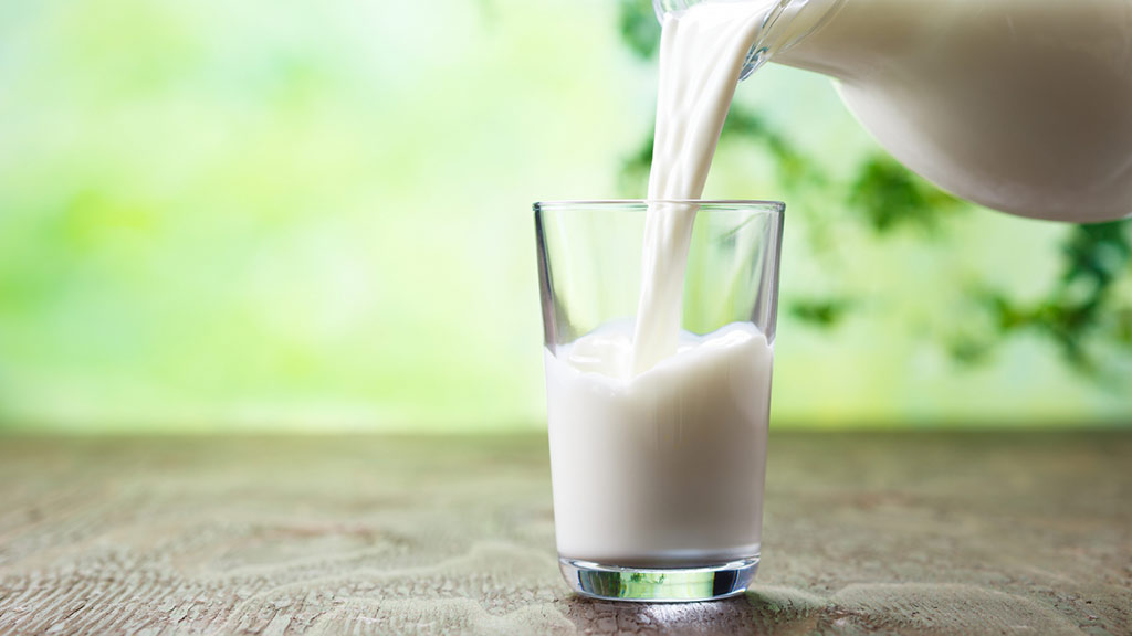glass of milk being poured