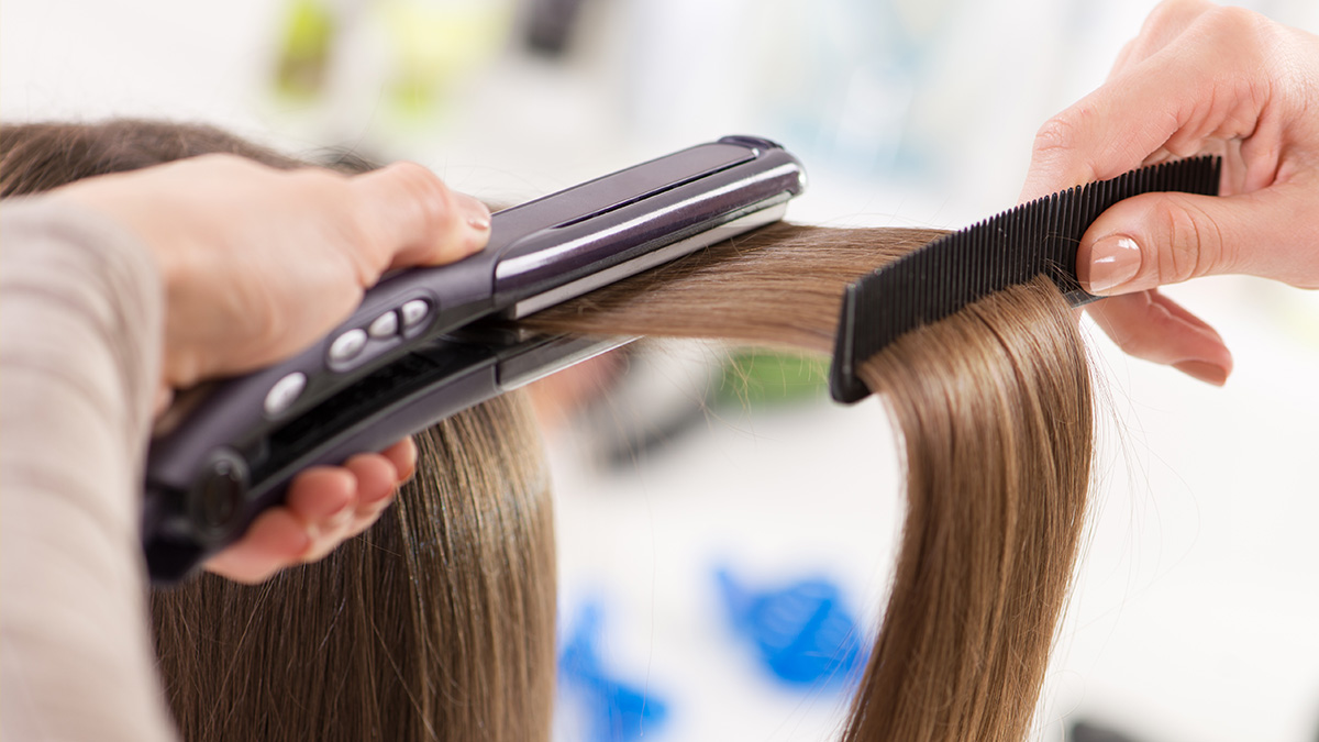 combing and straightening hair