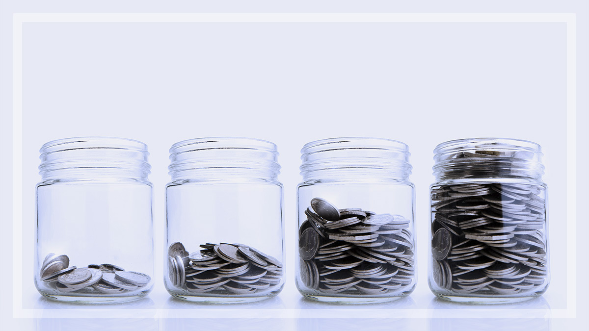 four jars with coins being saved