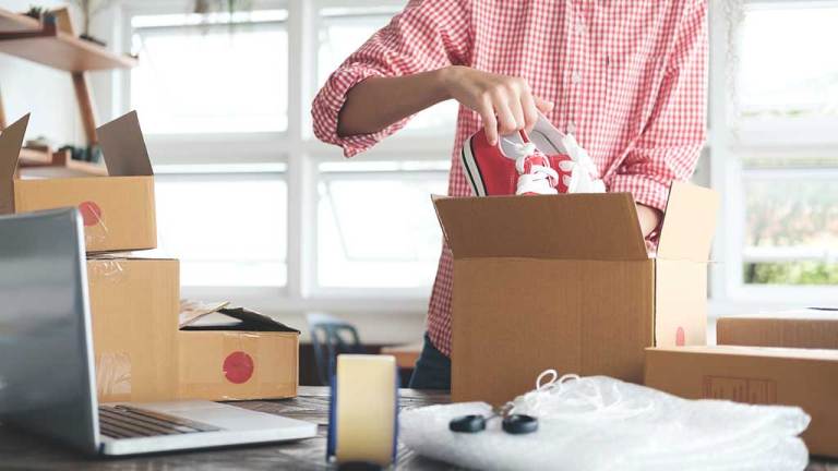 packing shoes in box for posting