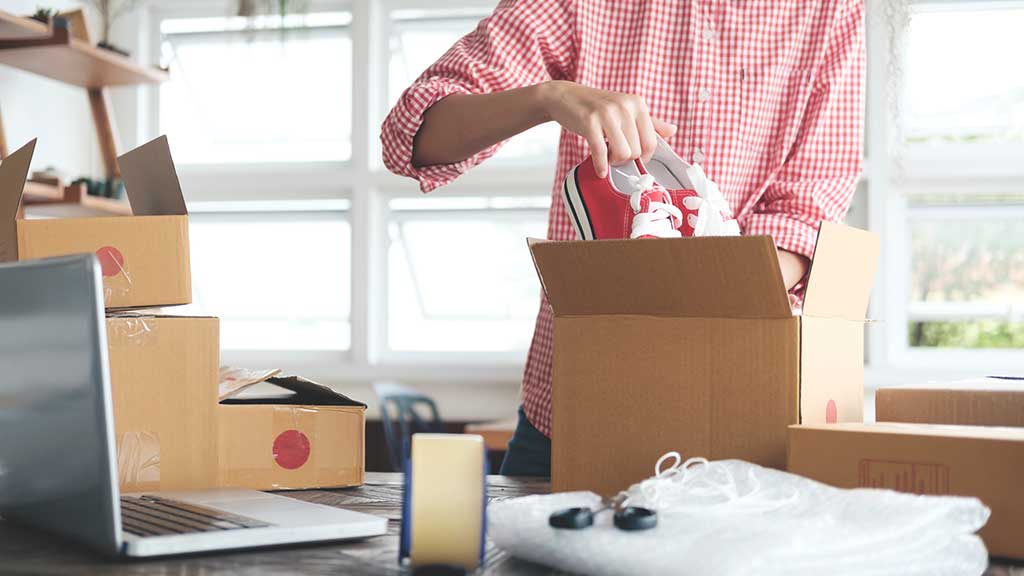 packing shoes in box for posting