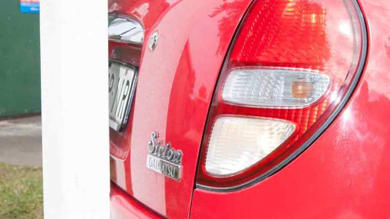 car reversed very close to pole