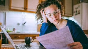 young woman looking at documents
