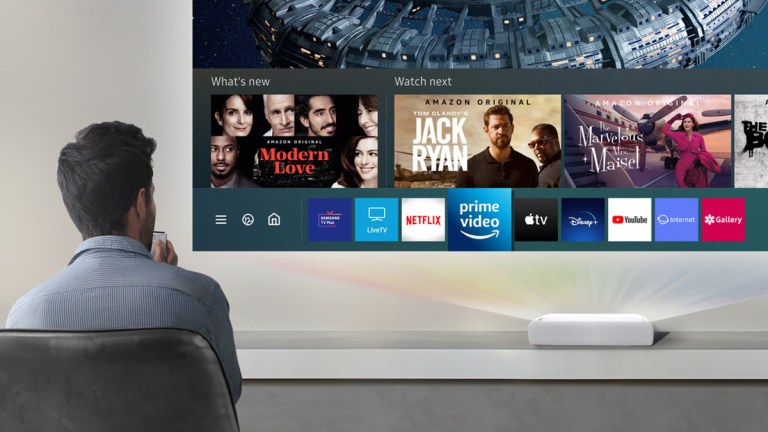 man watching TV using a projector