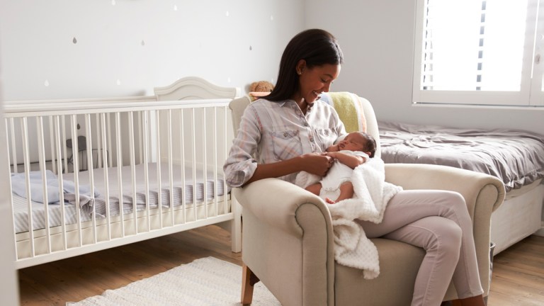 woman sitting in nursery at home