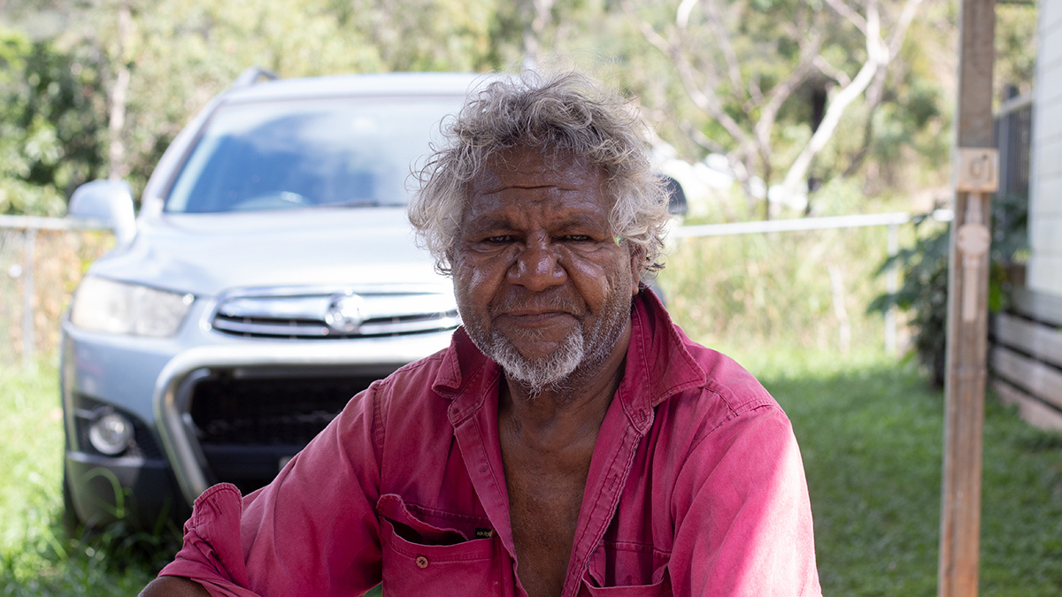cedric_friday_sitting_in_front_of_his_car