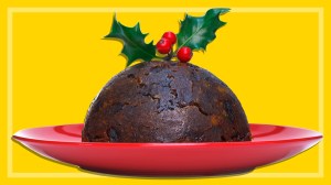 traditional Christmas pudding on a red plate on a yellow background
