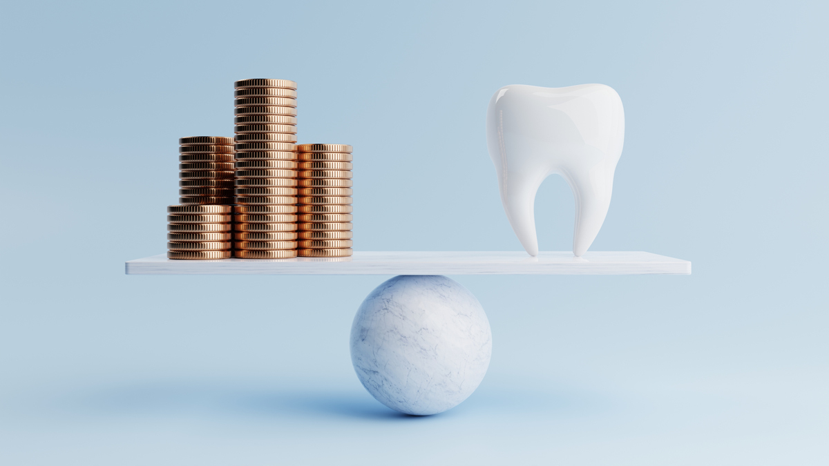 a scale showing piles of coins balanced next to a tooth