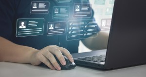 person_accessing_client_database_on_laptop