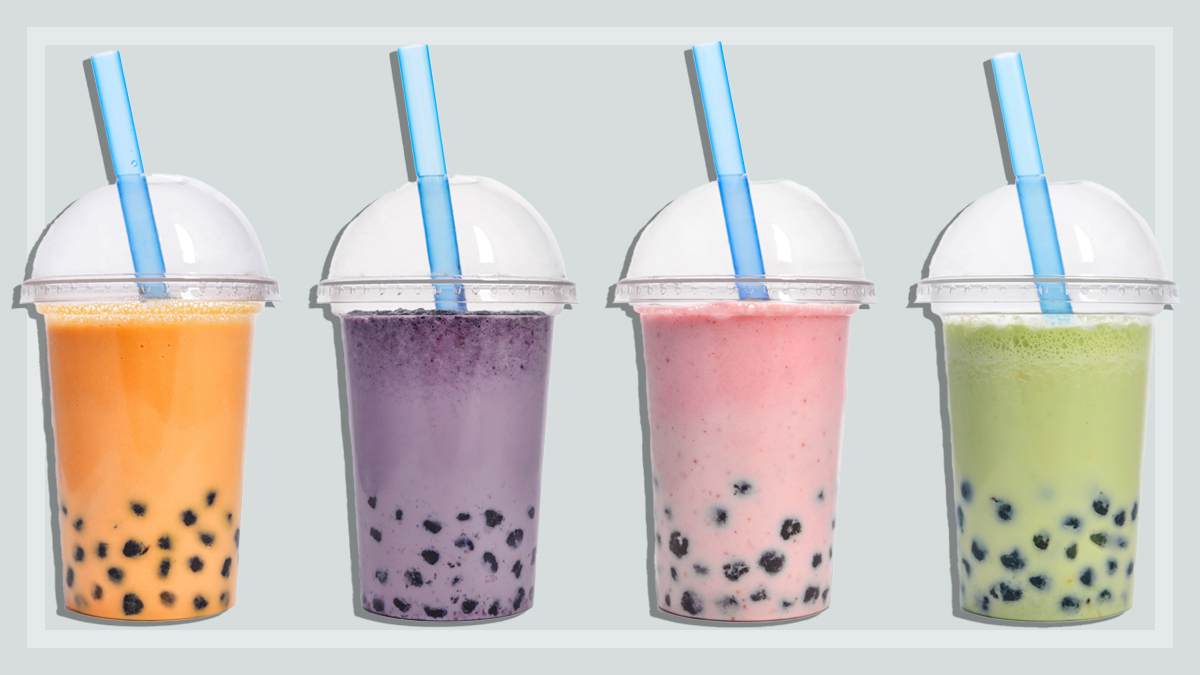 four coloured bubble teas on a light grey background