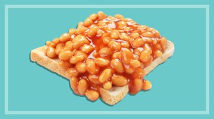 baked beans on toast on a teal background