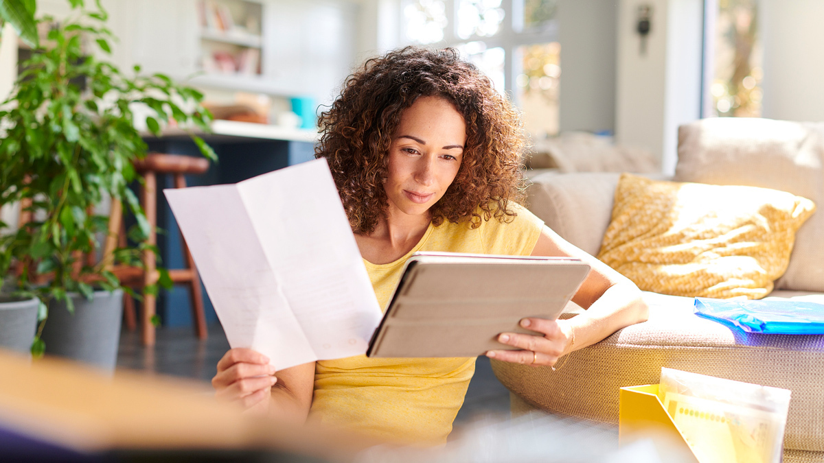 woman looking over bills