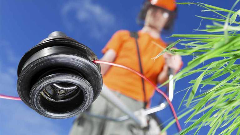 gardener using line trimmer