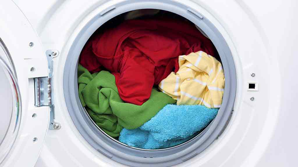 washing machines loaded with clothes