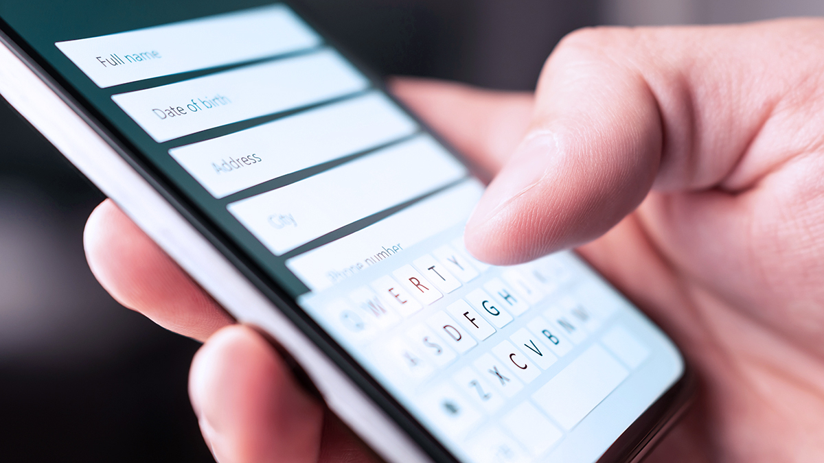 person entering their details into webform on smartphone