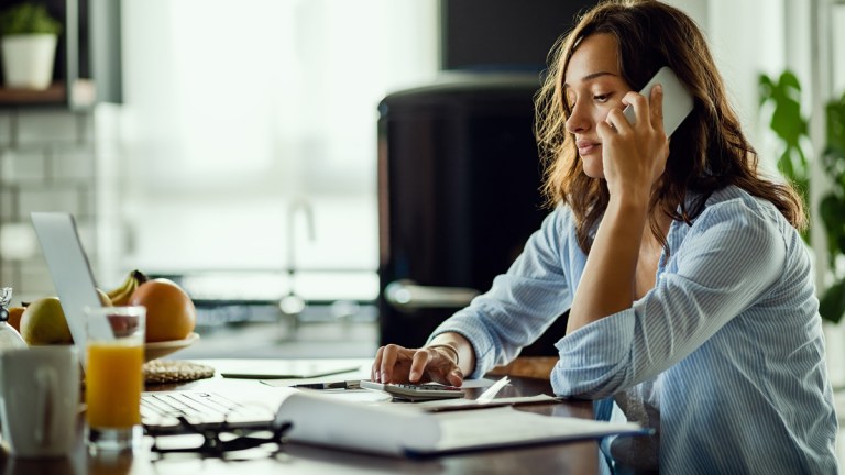 woman in financial stress on phone