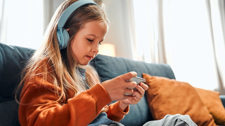 child watching movie or gaming on smartphone