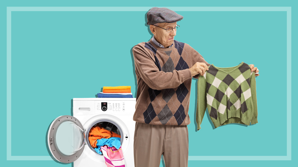 man holding a shrunken sweater in the wash
