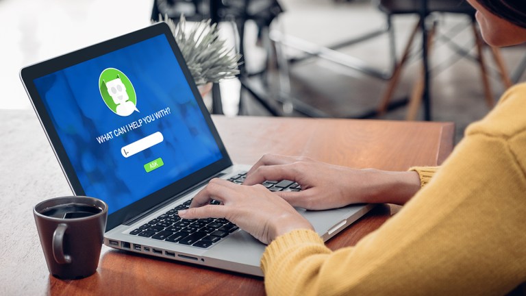 person using chatbot on laptop
