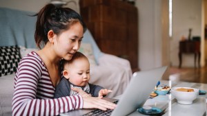 single_mother_looking_at_insurance_on_laptop