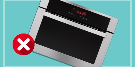 oven on teal background with cross
