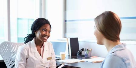 surgeon consulting with patient