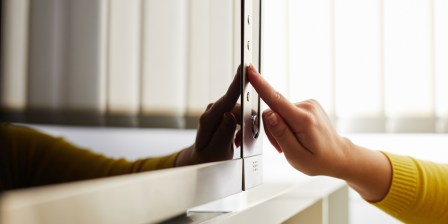 A person using an inverter microwave at home