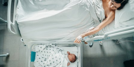 woman and newborn baby in hospital