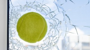 tennis ball going through a glass window