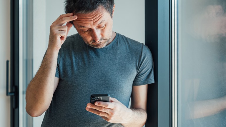 frustrated person on smartphone