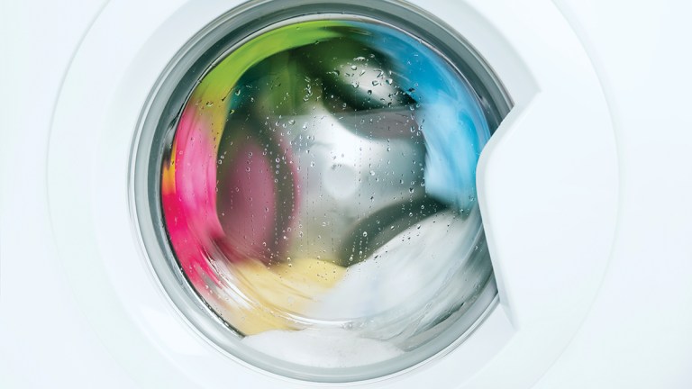 clothes in washing machine on wash cycle