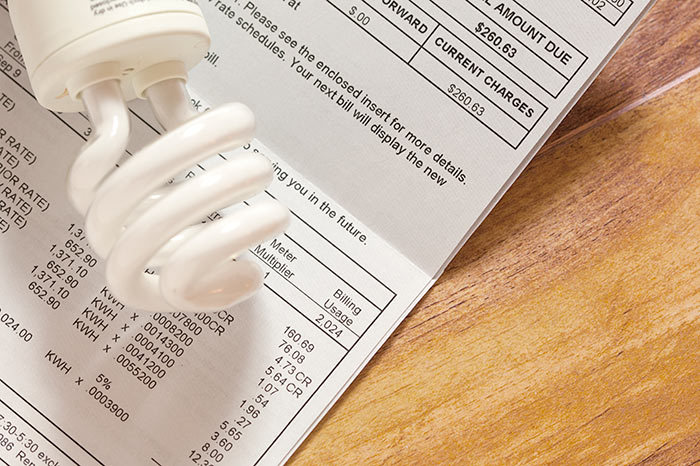 cfl_light_bulb_on_an_electricity_bill