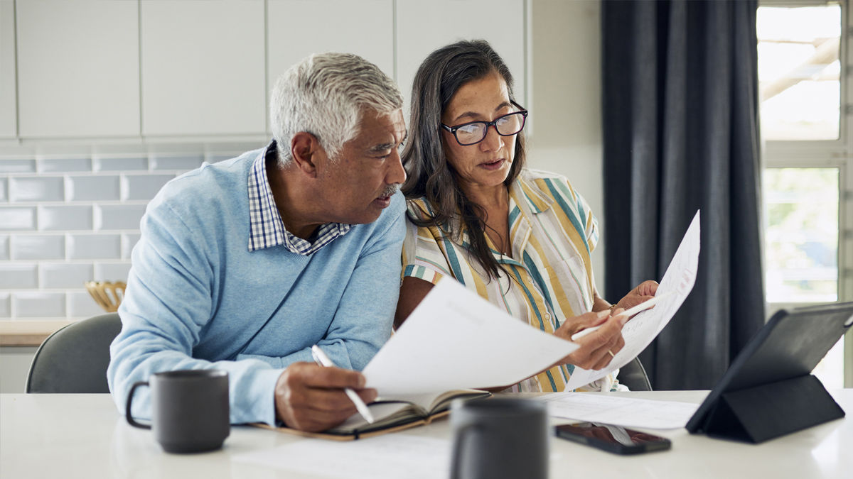 retired couple checking their superannuation statement