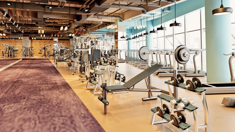 weights and equipment in an empty gym
